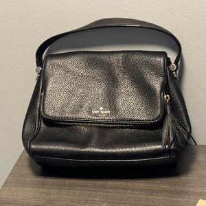 Black Kate Spade crossbody with tassel and gold hardware! Fair condition.